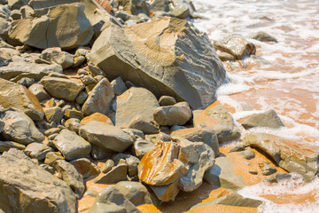 small waves break intro yellow beach