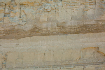 details of a natural stone wall on a beach