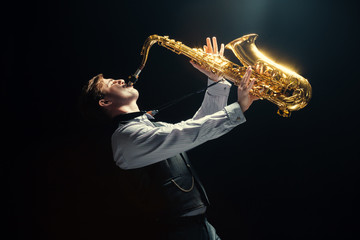 Young man playing the Saxophone