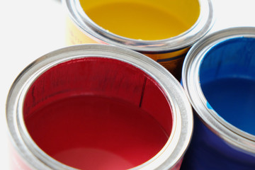 open cans of colored paints