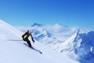 Fototapeta na wymiar Skier in high mountains