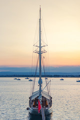 Sail yacht in the pier of Siracusa (Sicily - Italy) at the sunset..