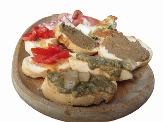Typical rustic tuscan appetizer with crostini, prosciutto, brawn, salami, cheese on a wooden tray . Italian starter isolated on white background