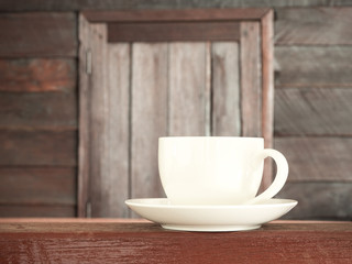 Cup coffee on wooden table old wood background