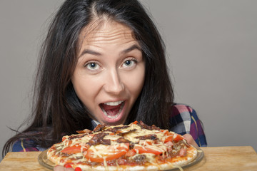 happy woman with pizza on white background