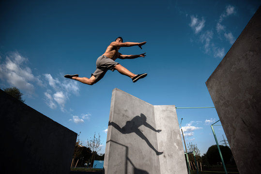 Teenager jump parkour on the walls