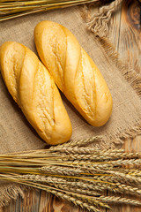 Freshly baked bread on wooden table