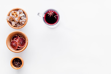 Celebrate new year winter evening with hot drink. Mulled wine or grog ingredients. White background top view. Space for text