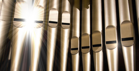 old organ pipes with a strong flash of light