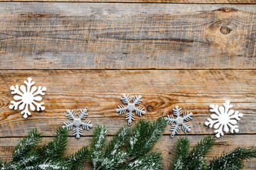 new year 2018 greeting with spruce branches and snowflake decorations on wooden background top veiw space for text