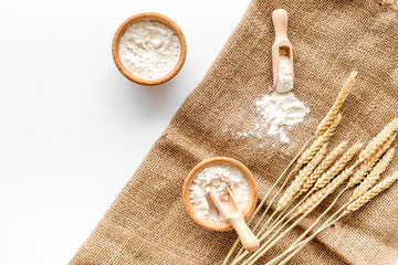Production of wheat and rye flour from ear on white desk background top view mock-up