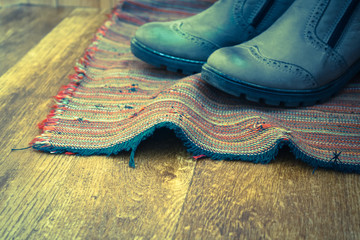 Vintage boots on the carpet close up