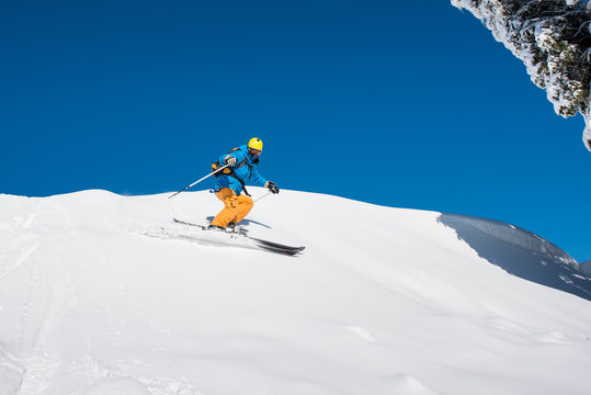 Shot of a professional freeride skier skiing in the Carpathians mountains on a sunny winter day nature recreation active sportive hobby lifestyle sports concept