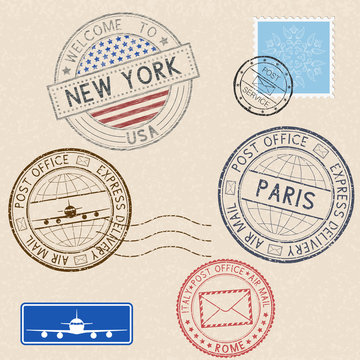 Postmarks and tourist stamps on beige background