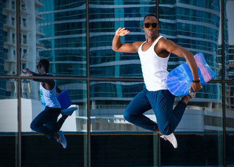 Obraz premium Young Energetic Guy Jumping