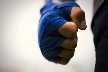 Picture of a male fist in boxing bandages. Photographed in a beautiful perspective