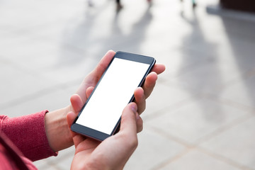 Man uses his Mobile Phone outdoor, close up