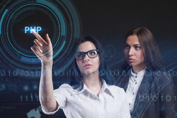 The concept of business, technology, the Internet and the network. A young entrepreneur working on a virtual screen of the future and sees the inscription: PHP
