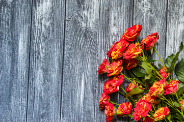 Naklejka na ściany i meble Still life with roses flowers on the wooden background