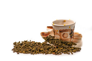 Green tea scattered on white