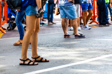 People in street waiting in queue