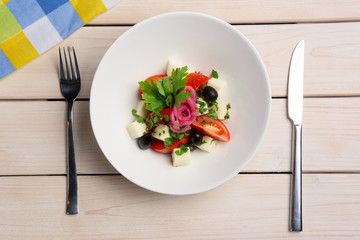 Salad with mozzarella, tomato and olives. Top view.