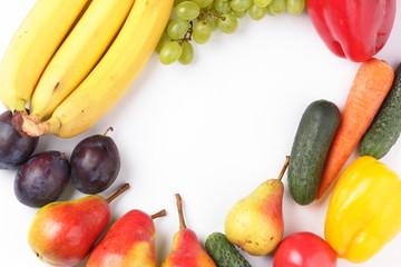 Fruits and vegetables on a white background with a place for inscription for the designer