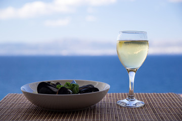 Tasty moule and a glass of white wine
