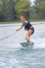young woman water skiing on a sea
