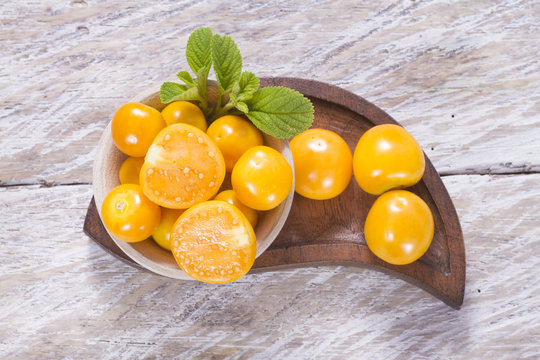 fresh uchuva fruits, The plant known as uchuva, uvilla, aguaymanto or ushun is a herbaceous plant belonging to the family solanaceae (Physalis peruviana)