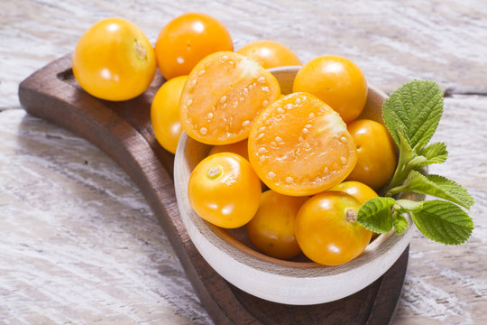 fresh uchuva fruits, The plant known as uchuva, uvilla, aguaymanto or ushun is a herbaceous plant belonging to the family solanaceae (Physalis peruviana)