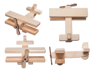Homemade wooden toy airplane, isolated on white background.