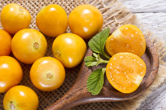 fresh uchuva fruits, The plant known as uchuva, uvilla, aguaymanto or ushun is a herbaceous plant belonging to the family solanaceae (Physalis peruviana)