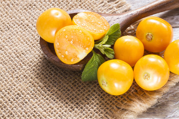 fresh uchuva fruits, The plant known as uchuva, uvilla, aguaymanto or ushun is a herbaceous plant belonging to the family solanaceae (Physalis peruviana)