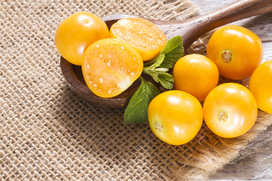 fresh uchuva fruits, The plant known as uchuva, uvilla, aguaymanto or ushun is a herbaceous plant belonging to the family solanaceae (Physalis peruviana)