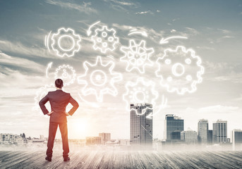 Cogwheel engine drawn on screen as symbol for teamwork and coope