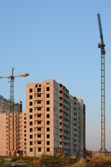 Fototapeta na wymiar The construction of the apartment building