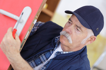 man fixing the door with screwdriver