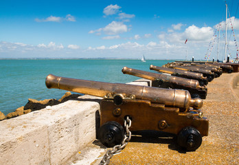 The starting cannons lined up looking out over the Solent during Cowes Week 2017 on the Isle of Wight, England
