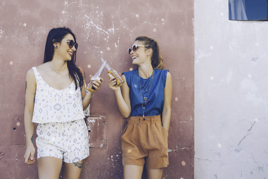 Grils Drinking Beer And Having Good Time