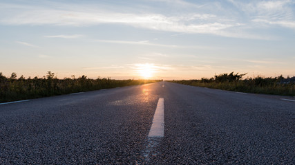 Extreme low angle view at an asphalt road