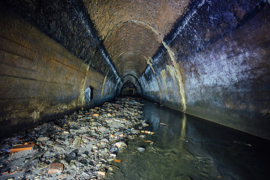Flooded by wastewater sewage collector of underground river. Sewer tunnel under city Voronezh 