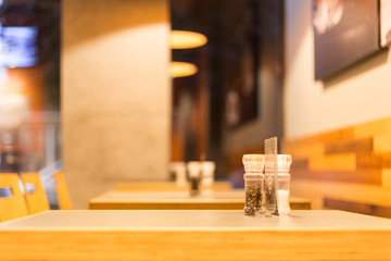 salt and pepper restaurant table interior empty