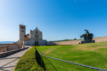 Famous Basilica of St. Francis of Assisi (Basilica Papale di San Francesco) at sunset in Assisi