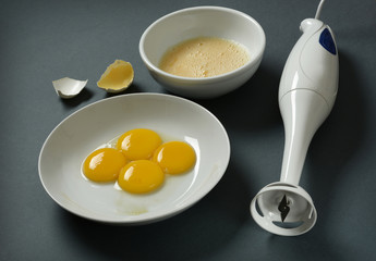 blender and eggs on the table - closeup