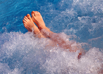 barefoot girl while taking bath in the thermal pool