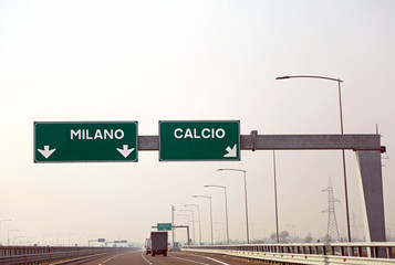 road sign on the Italian motorway for the cities called MILANO a