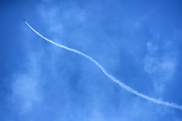 Fototapeta na wymiar Plane in blue sky