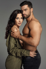 Sexy couple hugging at each other