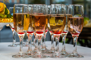 glasses with champagne and fruits